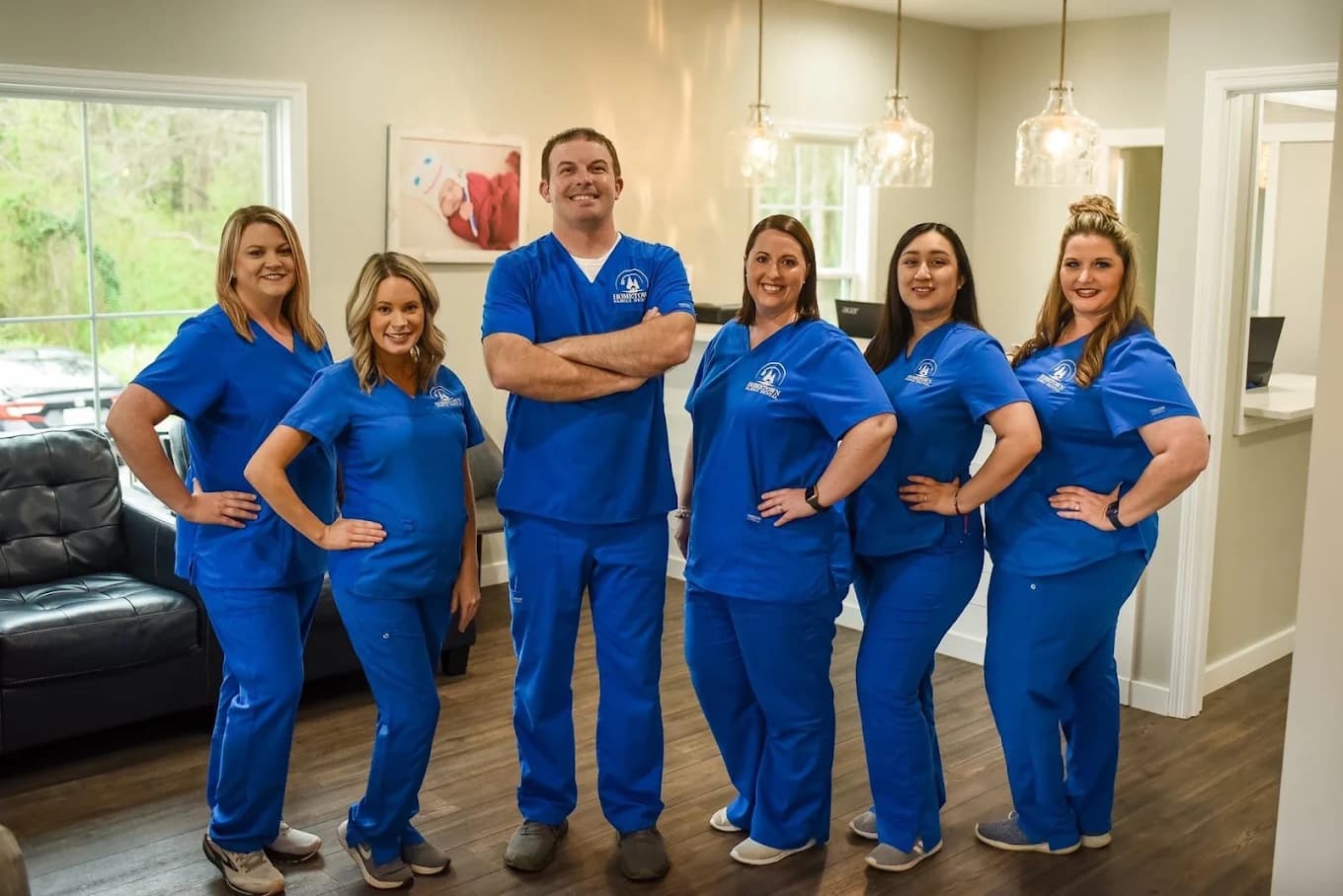 The Hometown Dental team standing together in their practice