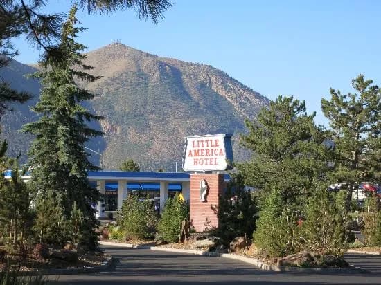 Little America Flagstaff hotel with mountains in the background