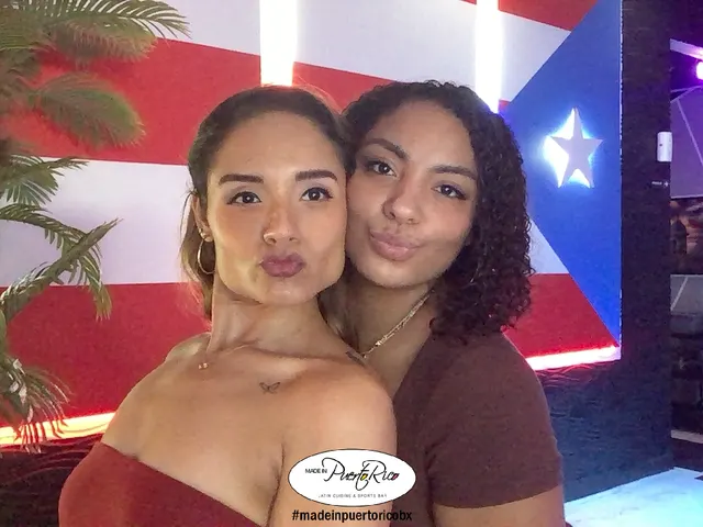 Two guests posing for a branded photo at Made in Puerto Rico Orlando