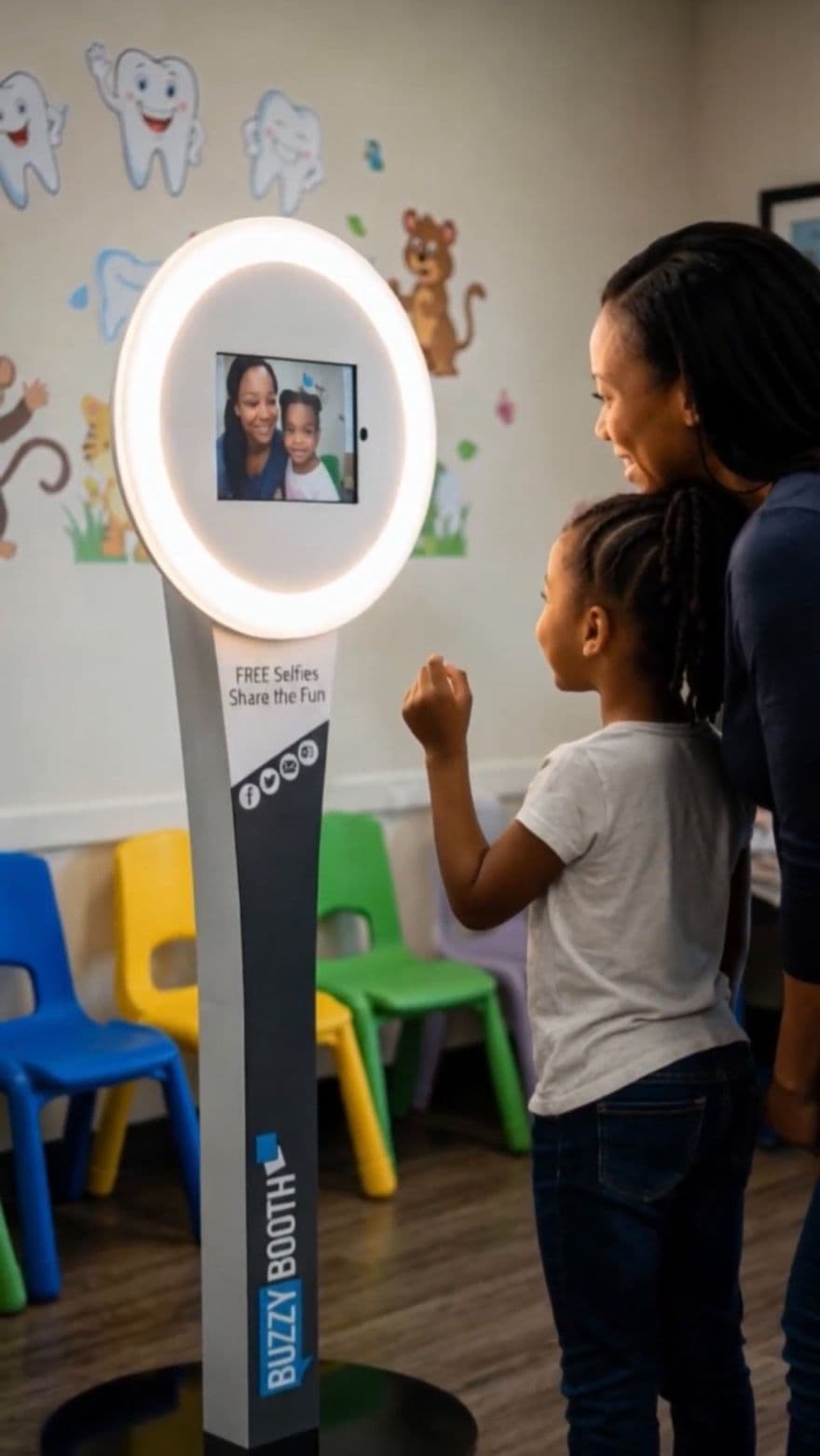 Dental marketing photo booth with a parent and child in a practice waiting room