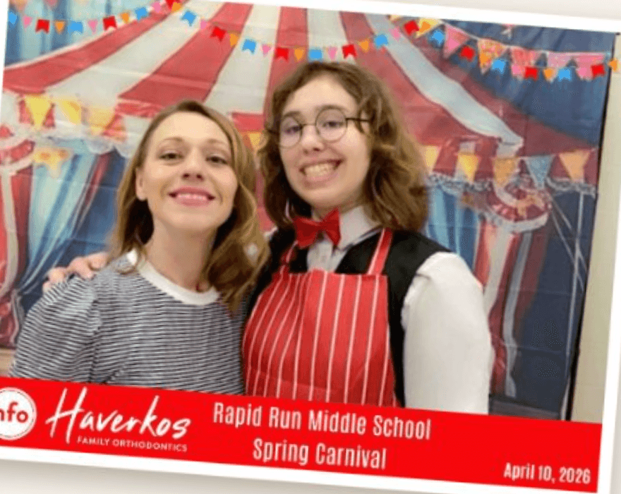 A branded Haverkos Family Orthodontics photo taken at a middle school carnival