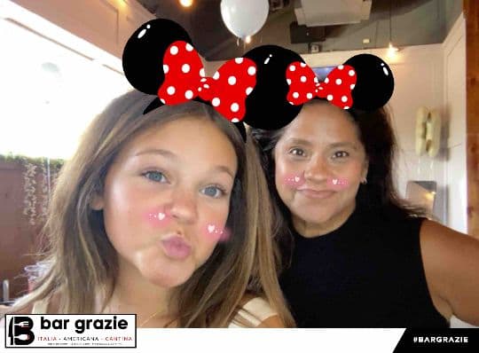 Two Bar Grazie guests posing with playful mouse-ear filters