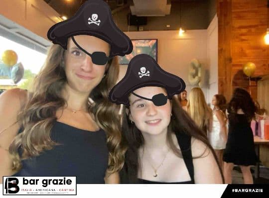 Two Bar Grazie guests posing with pirate photo filters