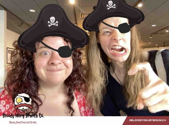 Two Bloody Mary Brunch Company guests posing with a pirate filter