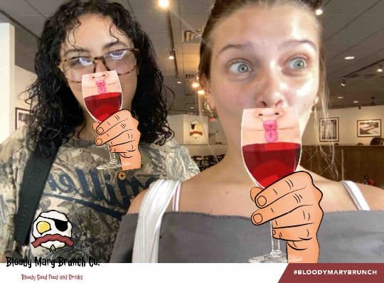 Two Bloody Mary Brunch Company guests posing with a drink filter