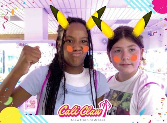 Two Cali Claw guests posing with playful character-ear filters