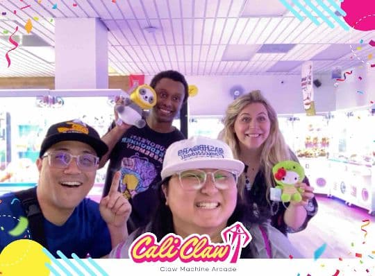 Four Cali Claw guests posing with prizes in a branded group photo