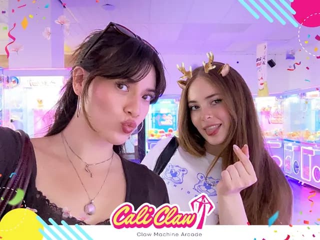 Two Cali Claw guests posing together in a branded holiday photo