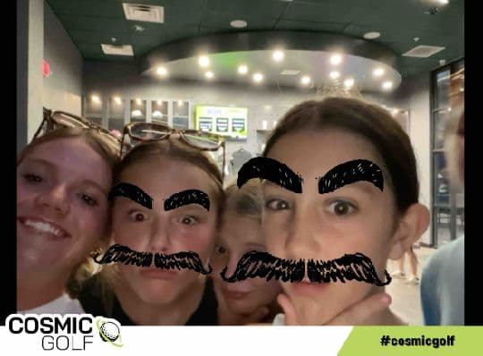 Guests using playful facial-hair filters at Cosmic Golf