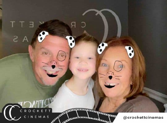 Crockett Cinemas family posing with a dog photo filter