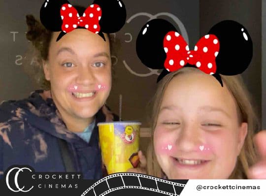 Crockett Cinemas guests posing with a mouse-ear photo filter