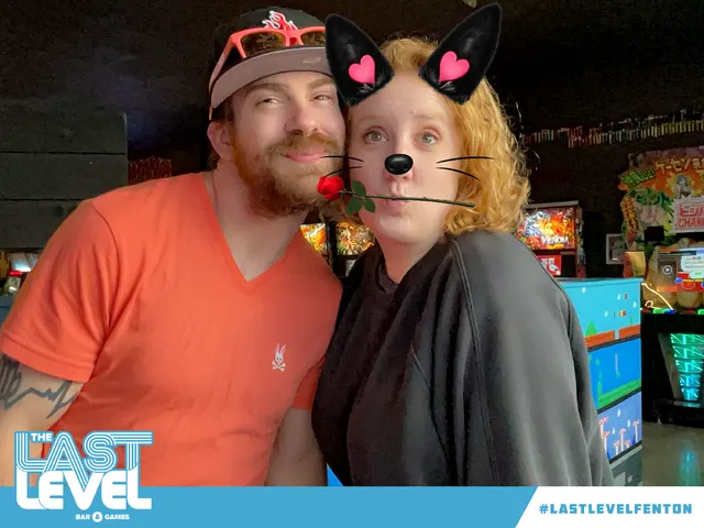 Two guests with a cat photo filter at Last Level Fenton