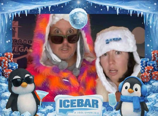 Two Ice Bar guests posing in winter hats and a colorful coat