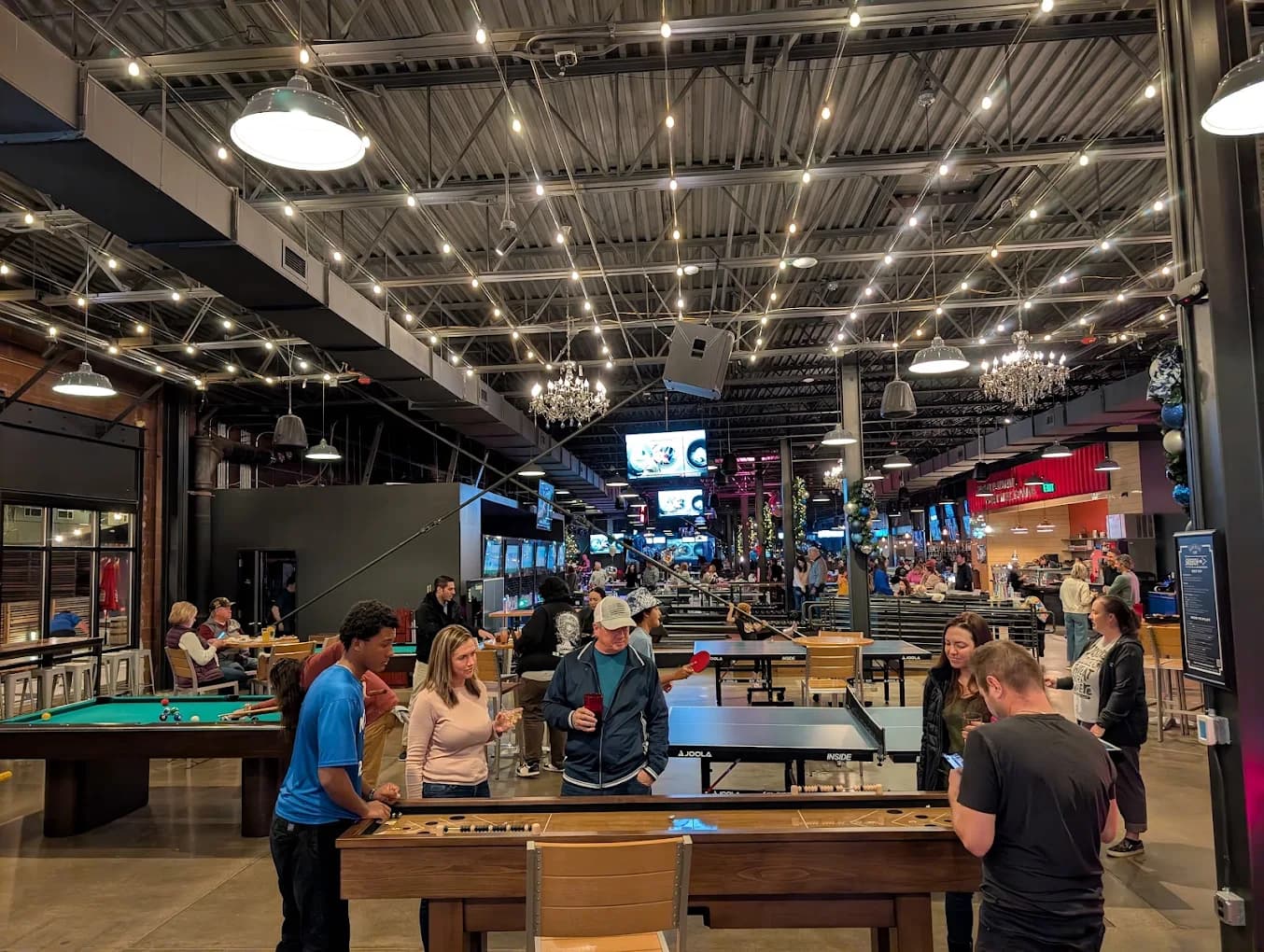 Guests playing games inside Pindustry in Greenwood Village, Colorado