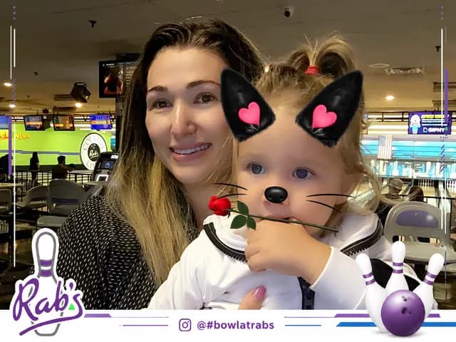 Rab’s Bowling guests posing with a playful animal filter
