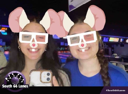 Two South 66 Lanes guests posing with playful mouse filters