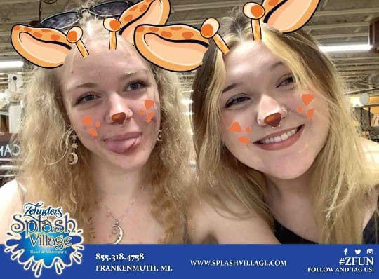 Two Zehnder’s guests posing with deer-ear photo filters