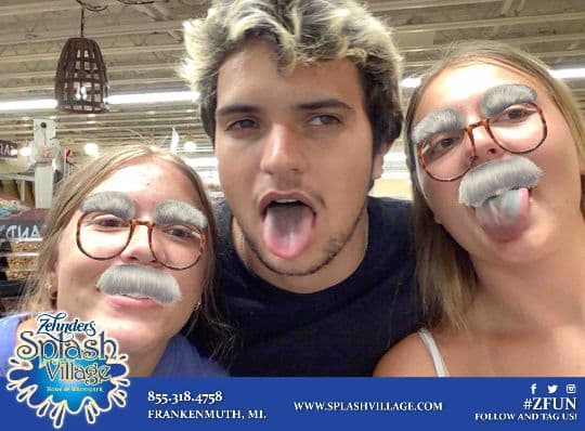Three Zehnder’s guests posing with playful moustache filters