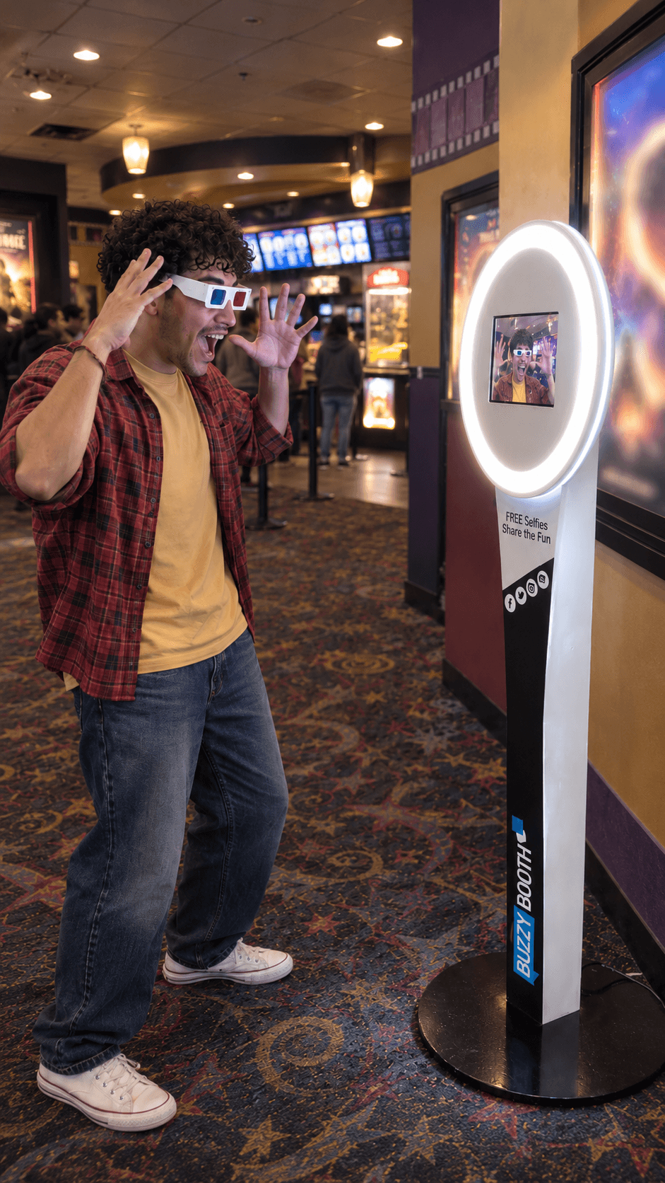 Moviegoer using a BuzzyBooth photo kiosk in a cinema lobby