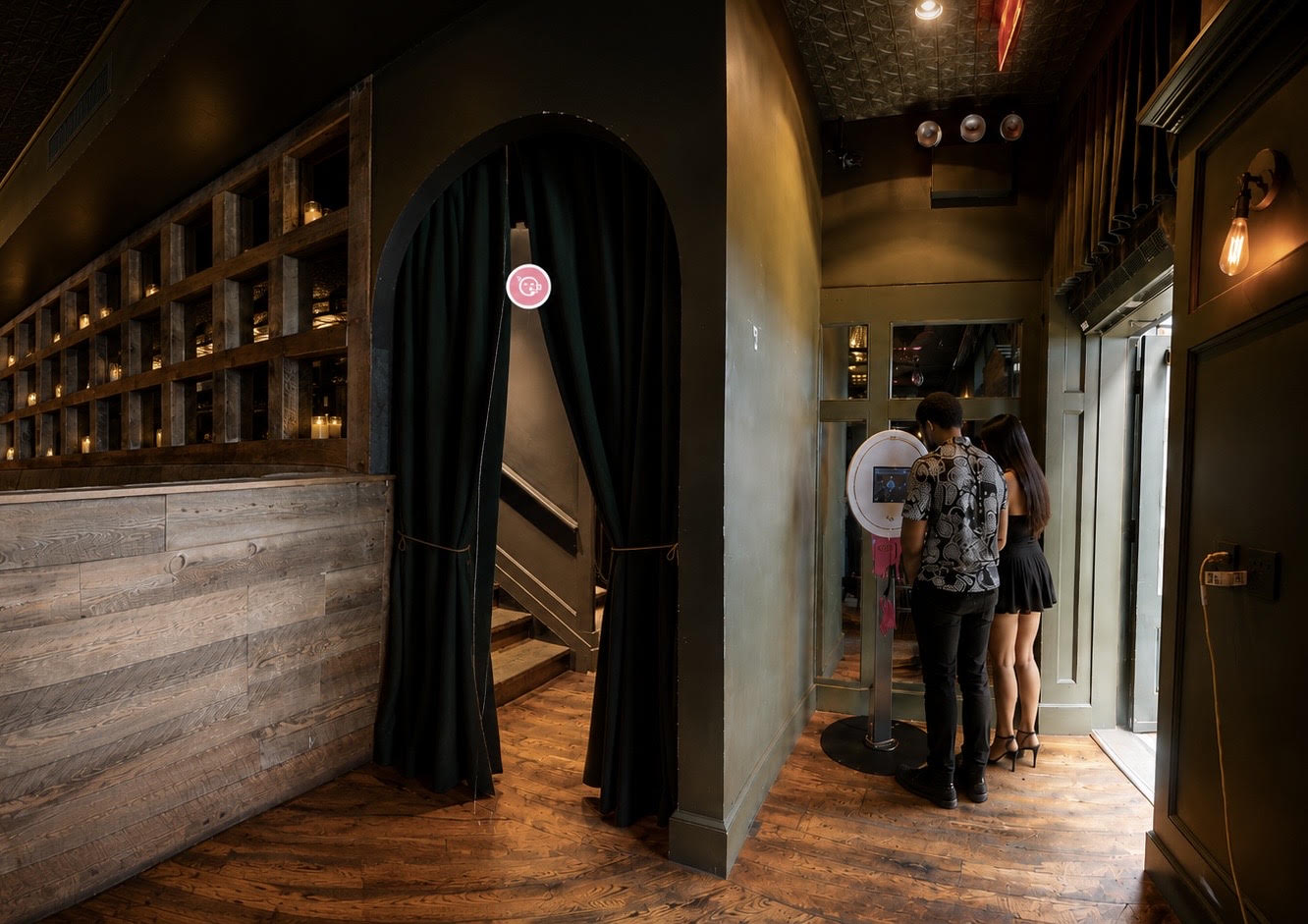 BuzzyBooth kiosk in Brandy's, two guests using the booth