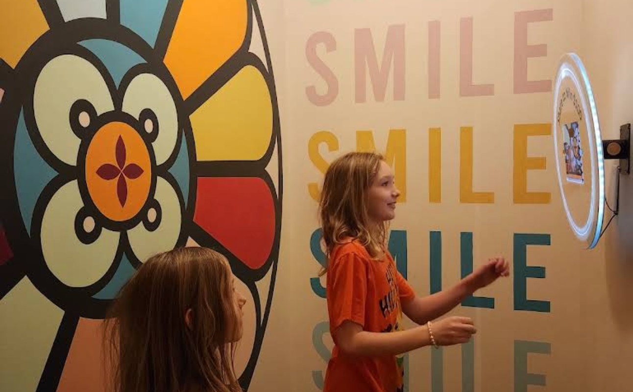 Guests using the BuzzyBooth in The Russell's dedicated photo booth room